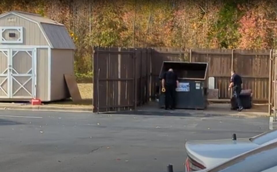 Jeffersonville Police search dumpster at Hallmark Apartments